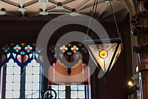 Antique Colorful Glass Chandelier in Bookshop and Large Windows