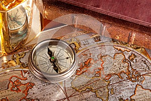 Antique compass and old map