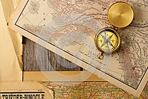 Antique compass over old map