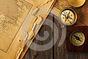 Antique compass over old map