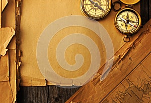 Antique compass over old map