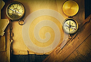 Antique compass over old map