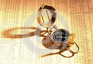 Antique compass on stock index