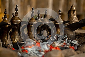 antique copper kettles on  coals