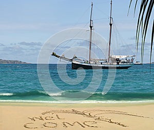 Antique cruise boat & welcome on tropical beach.