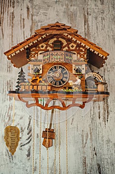 Antique cuckoo clock hanging on the wall