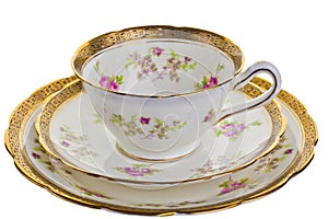 Antique cup, saucer and small plate.