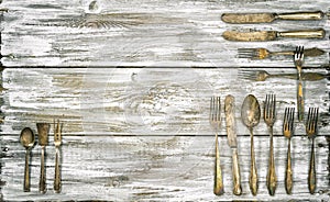 Antique cutlery rustic wooden background kitchen utensils vintage