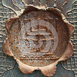Antique decorative menorah on a leaf of metal. photo