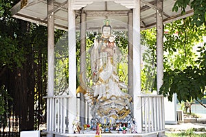 Antique deity Quan Yin or Kuan Yin chinese goddess statue in ancient small shrine for thai people travelers travel visit and