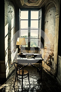 Antique desk. Historical lectern in front of a window.