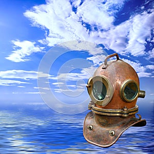 Antique diving helmet over seascape photo