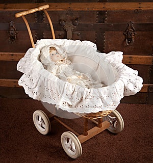 Antique doll in cradle photo