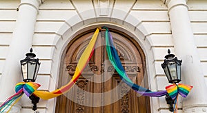 Antique door decorated in the colors of diversity