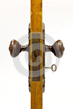 Antique door and door handle with skeleton key in