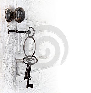 Antique door with keys in the lock photo