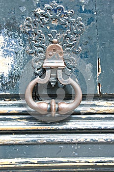 Antique door-knocker on old door