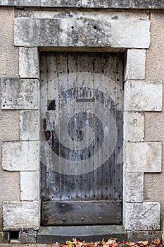 Antique door on a stone faÃ§ade