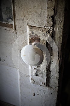 Antique Doorknob Against Peeling Paint