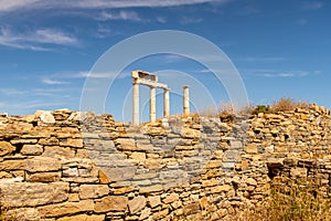 Antique doric columns and ruins on DELOS Island - mythological, historical, and archaeological site in Greece during sunny day