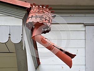 Antique downpipe on wooden house