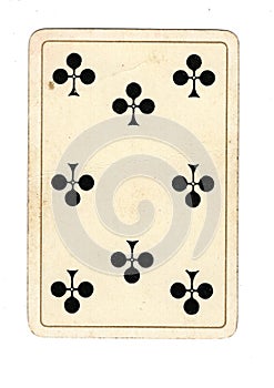 An antique eight of clubs playing card.