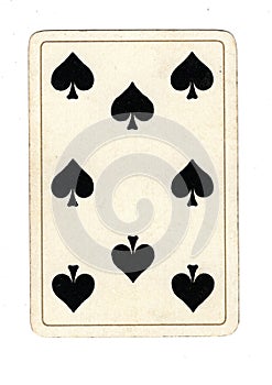 An antique eight of spades playing card.