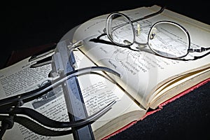 Antique Engineering book with Calipers in subdued light