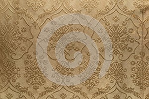 An antique fabric of embroidered silk with circulair and floral patterns and designs photo