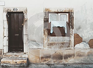 Antique facade with door and window