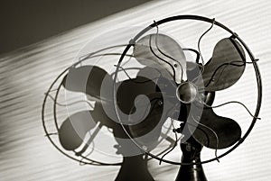 Antique Fan With Light Streaming Through the Window Blinds. photo