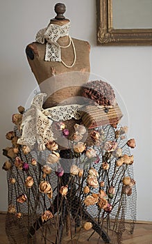 An Antique Female Mannequin Decoration With A Wire Netting Skirt Decorated By Roses In The Interior With An Old Frame In Vintage S