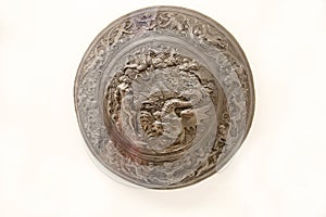 Antique fist shield with a beautiful coinage pattern isolated on a white background, Rotelan Italy. Cold weapons