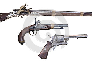 Antique flintlock rifle, percussion pistols and revolver. Evolution of Firearms.