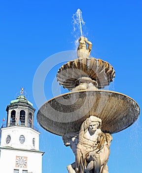 antique fountain with fresh water in the main square of the city photo