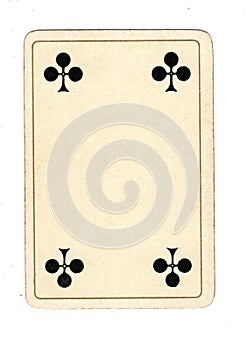 An antique four of clubs playing card.