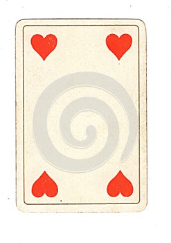 An antique four of hearts playing card.