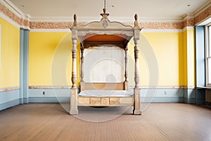 an antique four-poster bed in an empty room