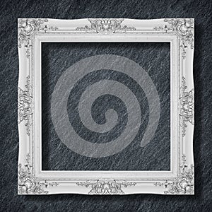 The antique frame on Dark grey black slate background or texture,white frame