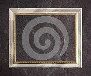 Antique frame isolated on Dark grey black slate background or texture.