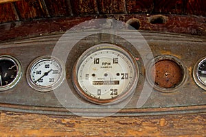 Antique gauges traditionally used on small commercial fishing or crabbing boats.