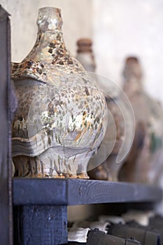 An antique glass demijohn for vinegar