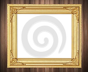 Antique gold frame on wooden wall