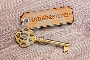 Antique golden house key on keyring