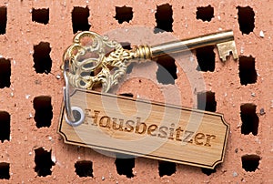 Antique golden house key on keyring