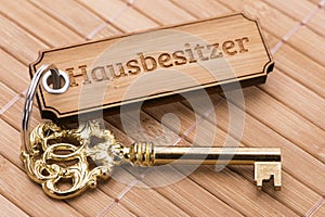 Antique golden house key on keyring