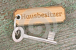 Antique golden house key on keyring