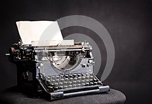 Antique grunge typewrite with inserted paper sheet