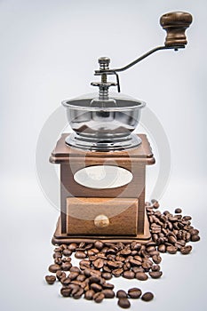 Antique hand-cranked coffee bean grinder photo