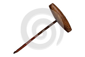 Antique hand drill isolated. Close-up of a vintage rusty hand drill with wooden handle isolated on a white background. Macro of